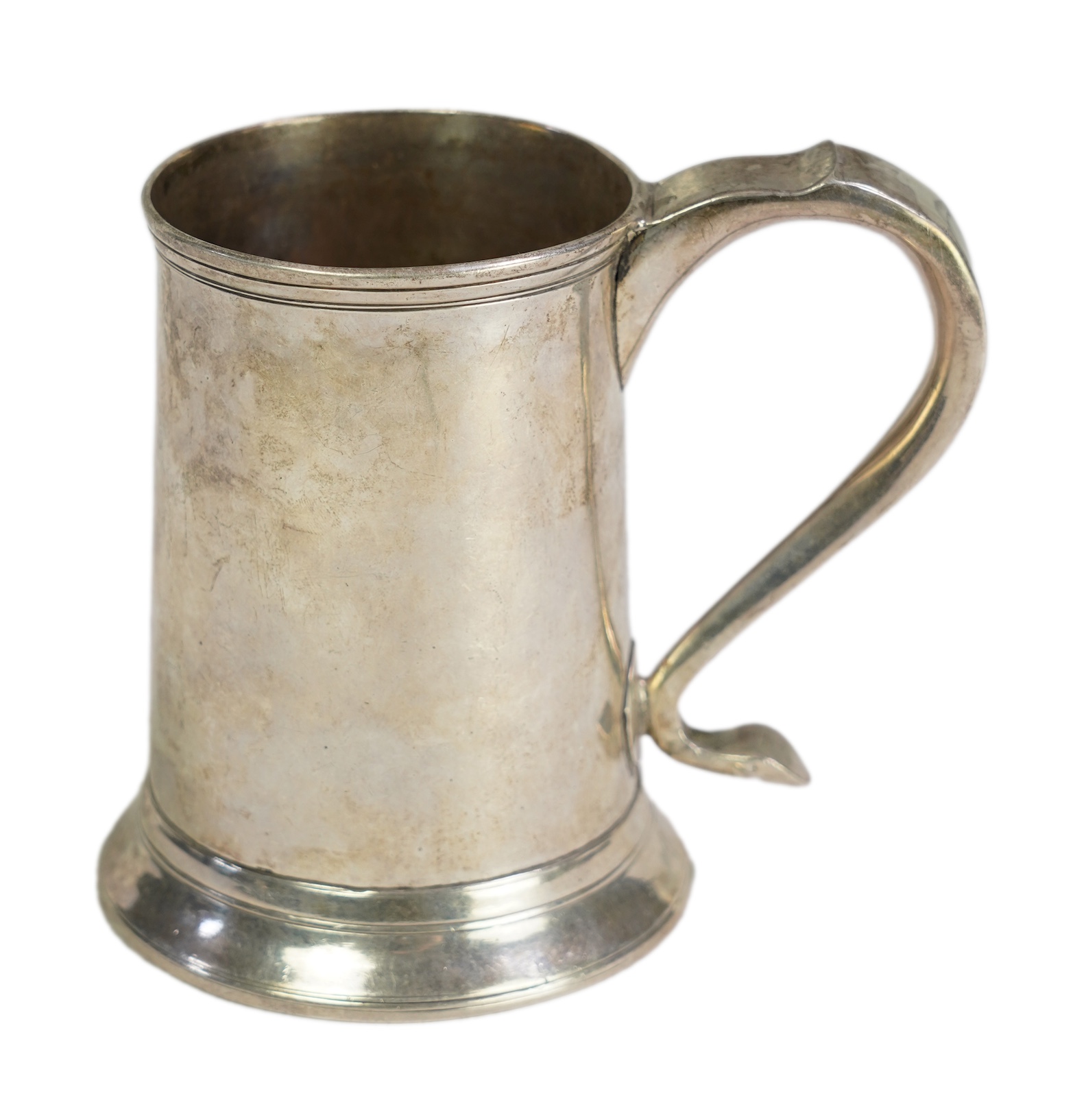 A George III provincial silver mug, by Dorothy Langlands, of plain design, with scroll handle, no date latter, Newcastle, circa 1810, height 13.1cm, 10.6oz, (a.f.).